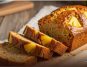 Moist carrot and pineapple bread loaf sliced on board